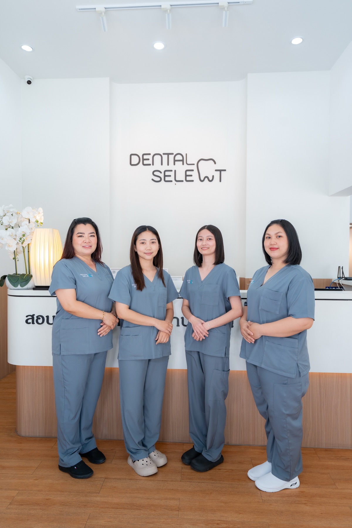 Dental Select Pattaya front desk staff standing in the clinic reception area